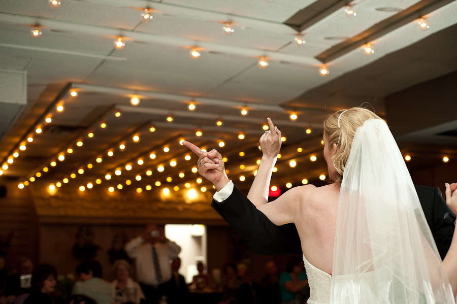 trinity-episcopal-terrys-catering-bloomington-wedding-13 funny first dance photo of bride and groom pointing fingers