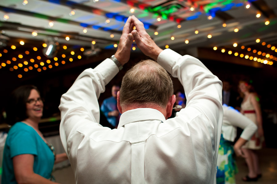 trinity-episcopal-terrys-catering-bloomington-wedding-22 father of groom walking like an egyptian at wedding in bloomington