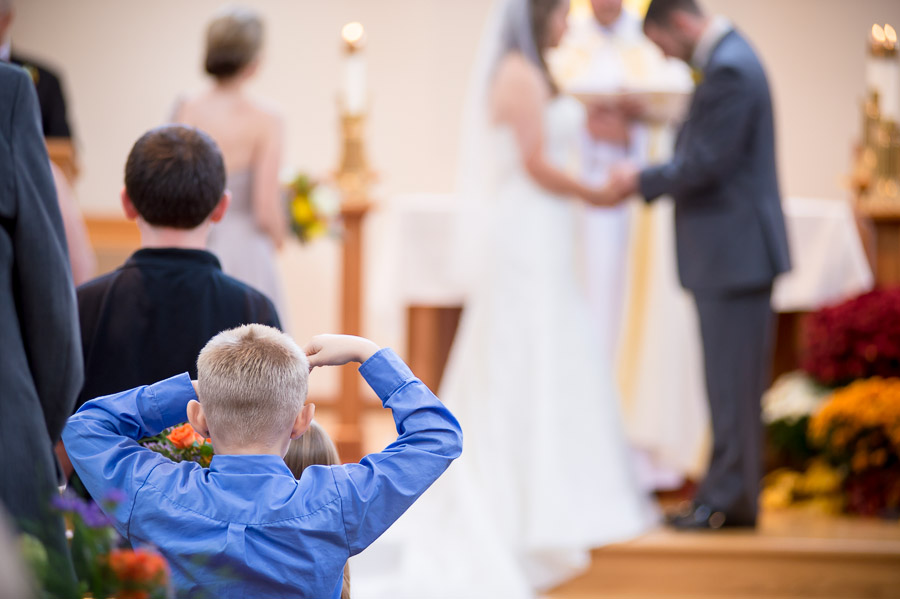 Nashville-Indiana-Brown-County-Wedding-Photography-Julianna-Levi-05 Pic of funny, cute kid watching wedding ceremony in Brown County Indiana