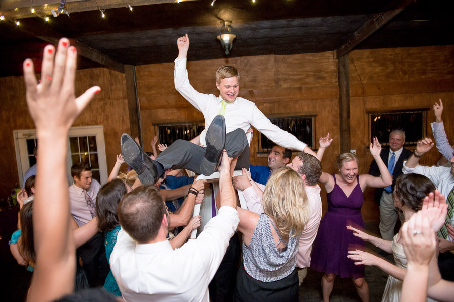 Bluemont-Vineyard-Wedding-Photography-Katie-Doug-14 fun, wild, energetic dance floor photo with groom in the air at Bluemont Vineyard wedding